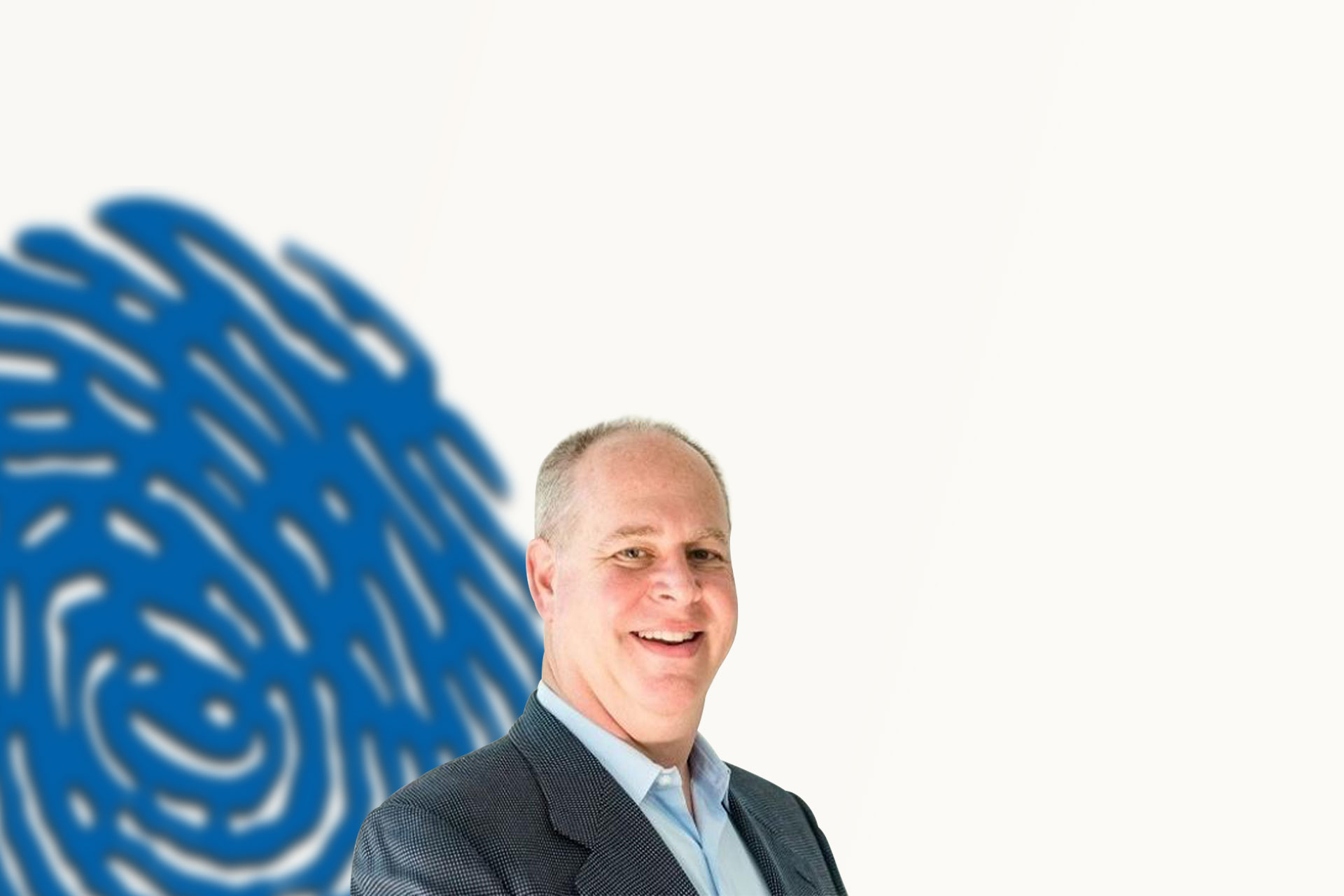 Rusty West Smiling Standing in Front of Blue Thumbprint Article Hero Background